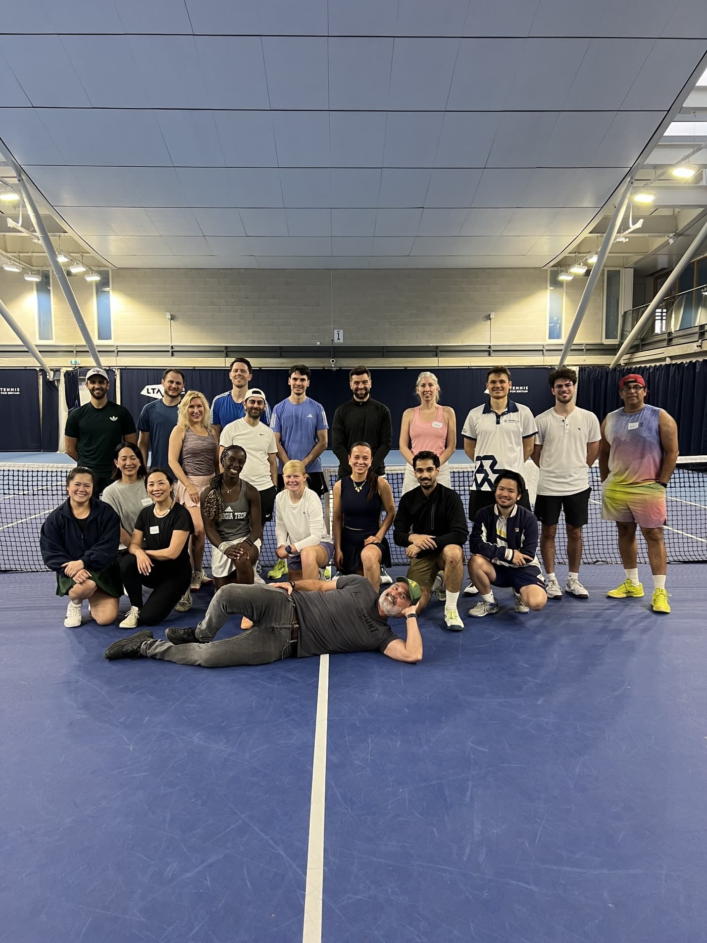 All Court members, coaches and pros on court at the National Tennis Centre.