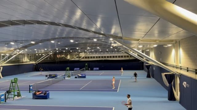 Indoor dome at the National Tennis Centre, looking across three courts