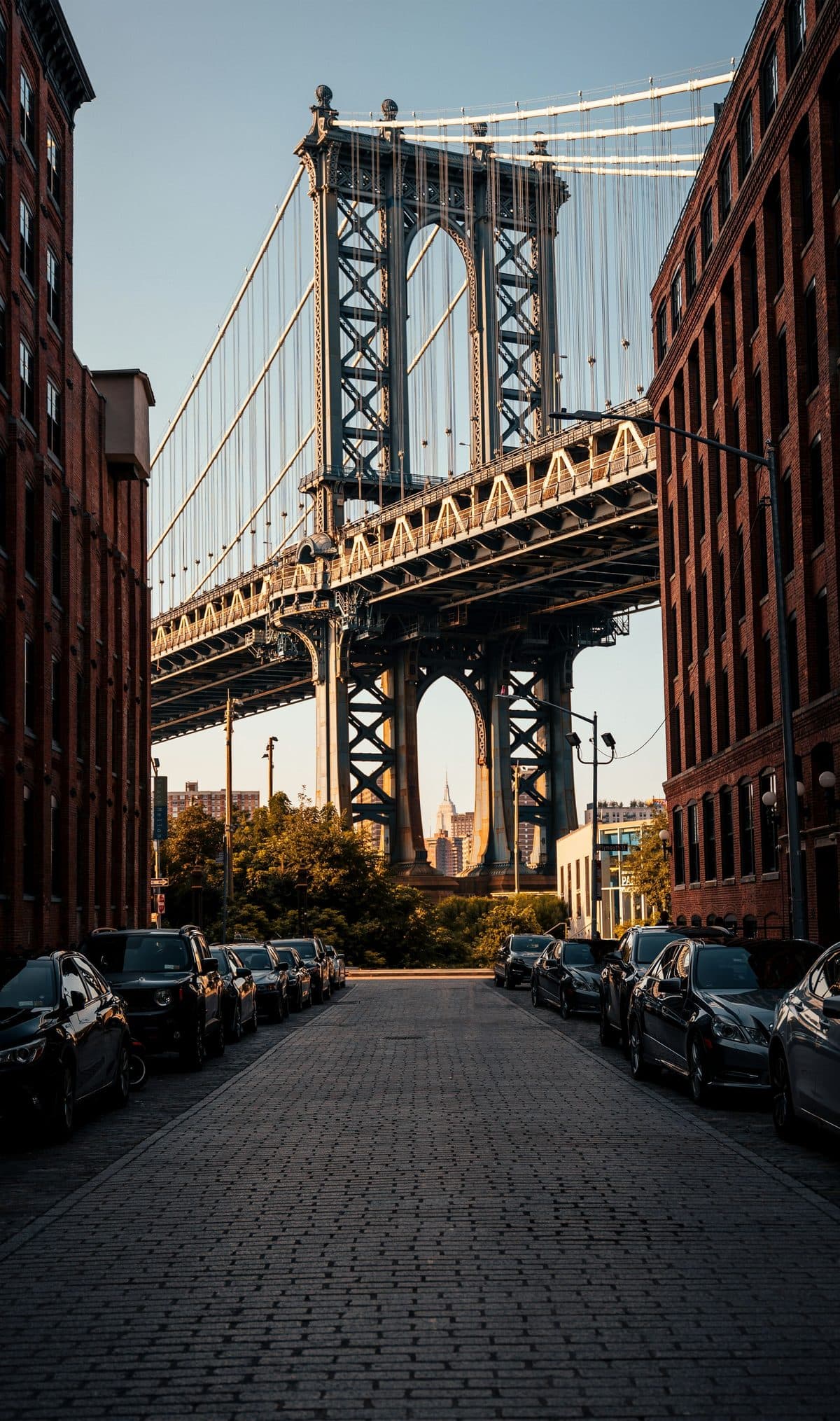 The Manhattan Bridge framed between the brick warehouses of Dumbo